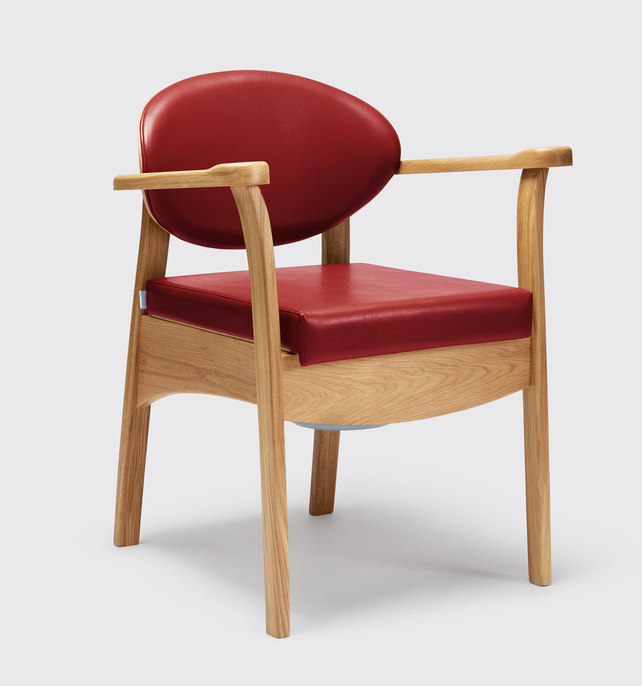 the image shows the delta red coloured oak commode chair