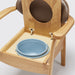 the image shows a close up of the pan on the mole coloured oak commode chair the 