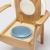 the image shows a close up of the pan on the oat coloured oak commode chair