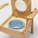 the image shows a close up of the pan on the oat coloured oak commode chair