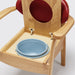 the image shows a close up of the pan on the red oak commode chair