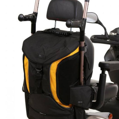 Image of the yellow and black torba go back of the back of a mobility scooter, holding a pair of cruches
