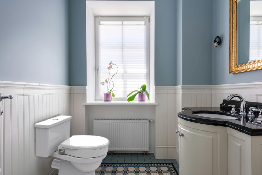 Ashby Lift Toilet Seat - Oval in bathroom, lid down