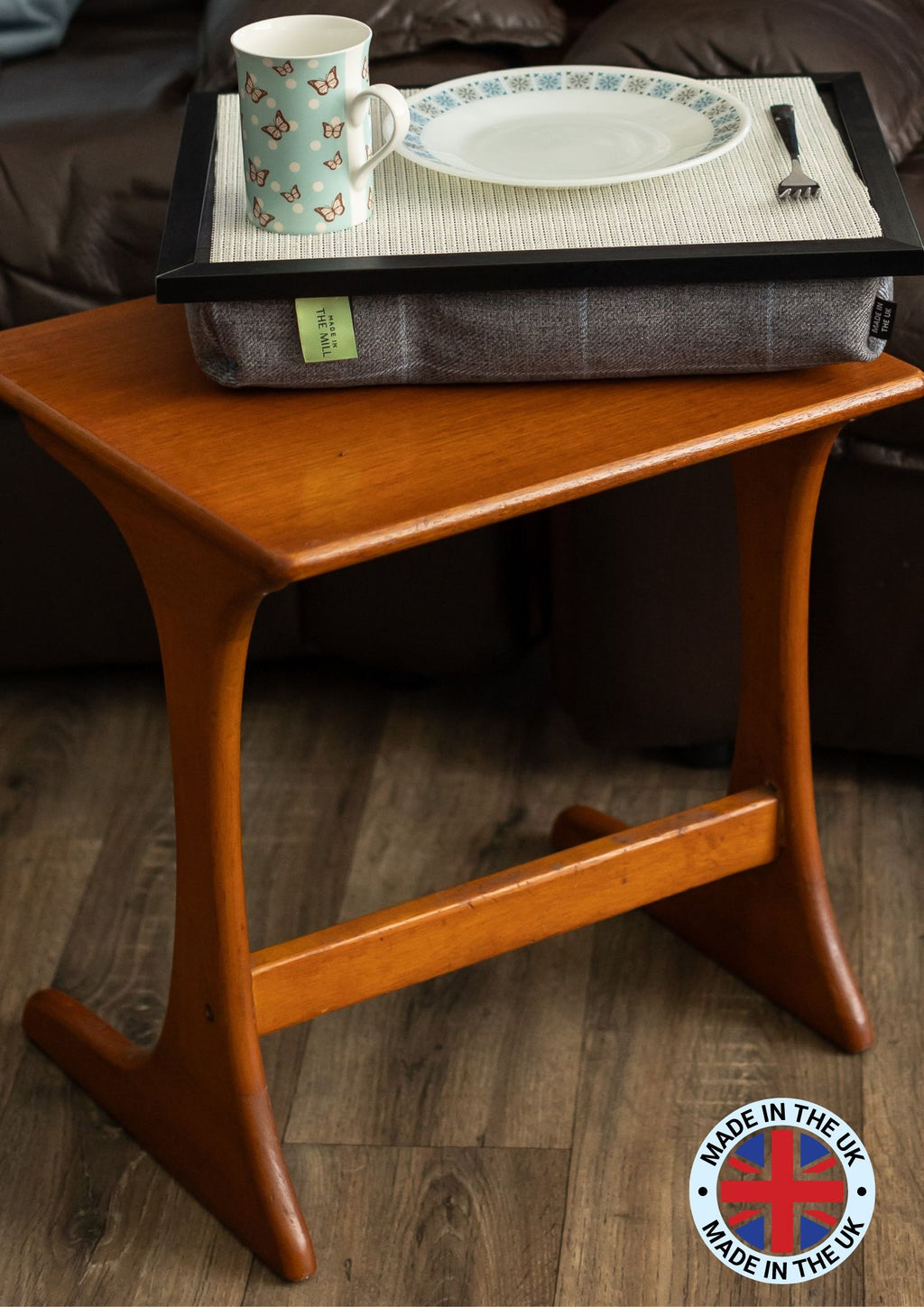 The luxury grey tweed lap tray on a coffee table in a cosy living room