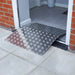 An aluminium threshold bridging ramp over a threshold