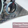 A close up of the wheel on a wheelchair going over an Aluminiu, Threshold Bridging Ramp
