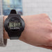 The digital style watch being worn by someone