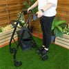 Someone using a black Lightweight Four Wheeled Rollator in a garden