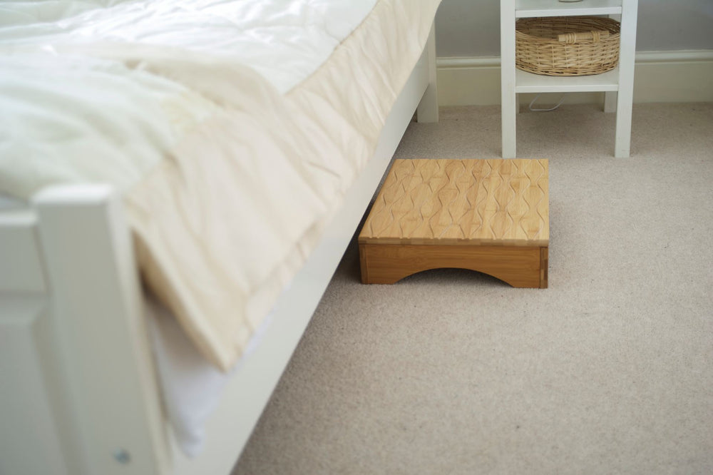 the image shows the panda bamboo step next to a bed