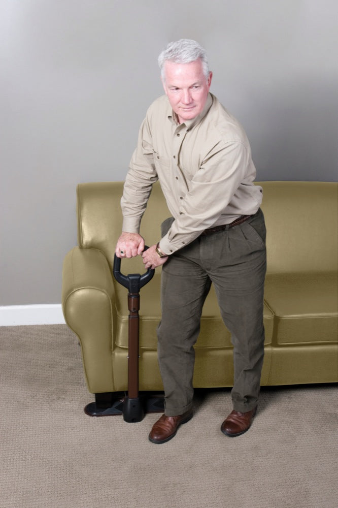 a man using the couchane chair riser