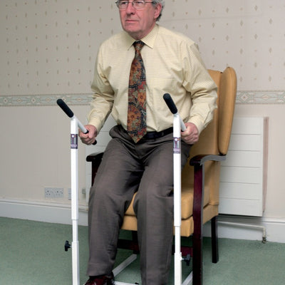 a man using the stand easy chair riser