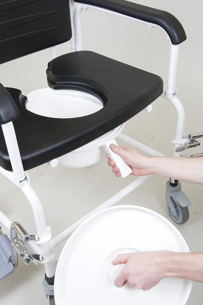 the image shows how to remove the pan on a bariatric mobile commode