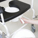 the image shows how to remove the pan on a bariatric mobile commode