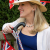 The image shows Charlotte from Classic Canes dressed smartly holding the crowning glory classic cane