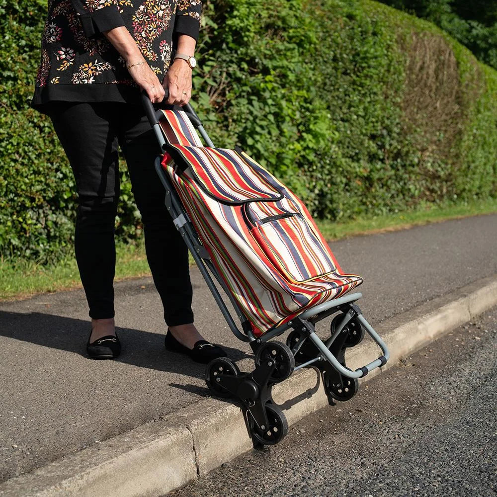 Someone pulling the Lifemax 'Take a Seat' Shopping and Leisure Trolley Stair Climber up a kerb