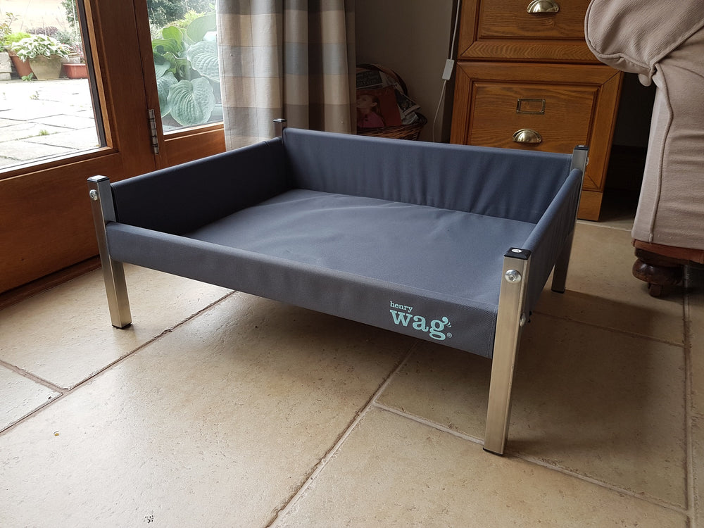 shows the Henry Wag Elevated Dog Bed in the home