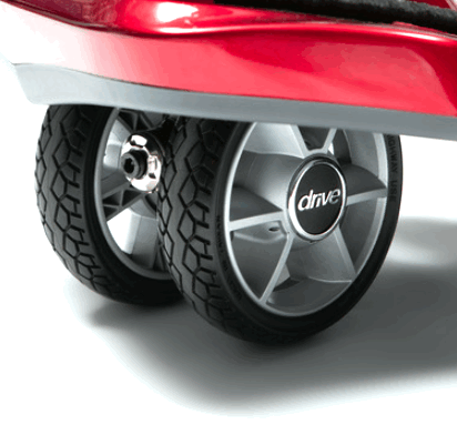 the image shows a close up of a wheel on the dual wheel auto fold scooter