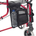 shows the side bag on a red tri-walker walking aid