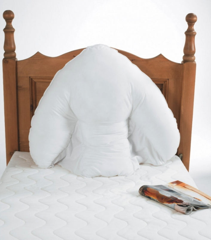 shows the harley batwing pillow on a bed