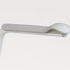 the image shows a clode up of the handgrip on the etac supporter toilet seat with fixed arms