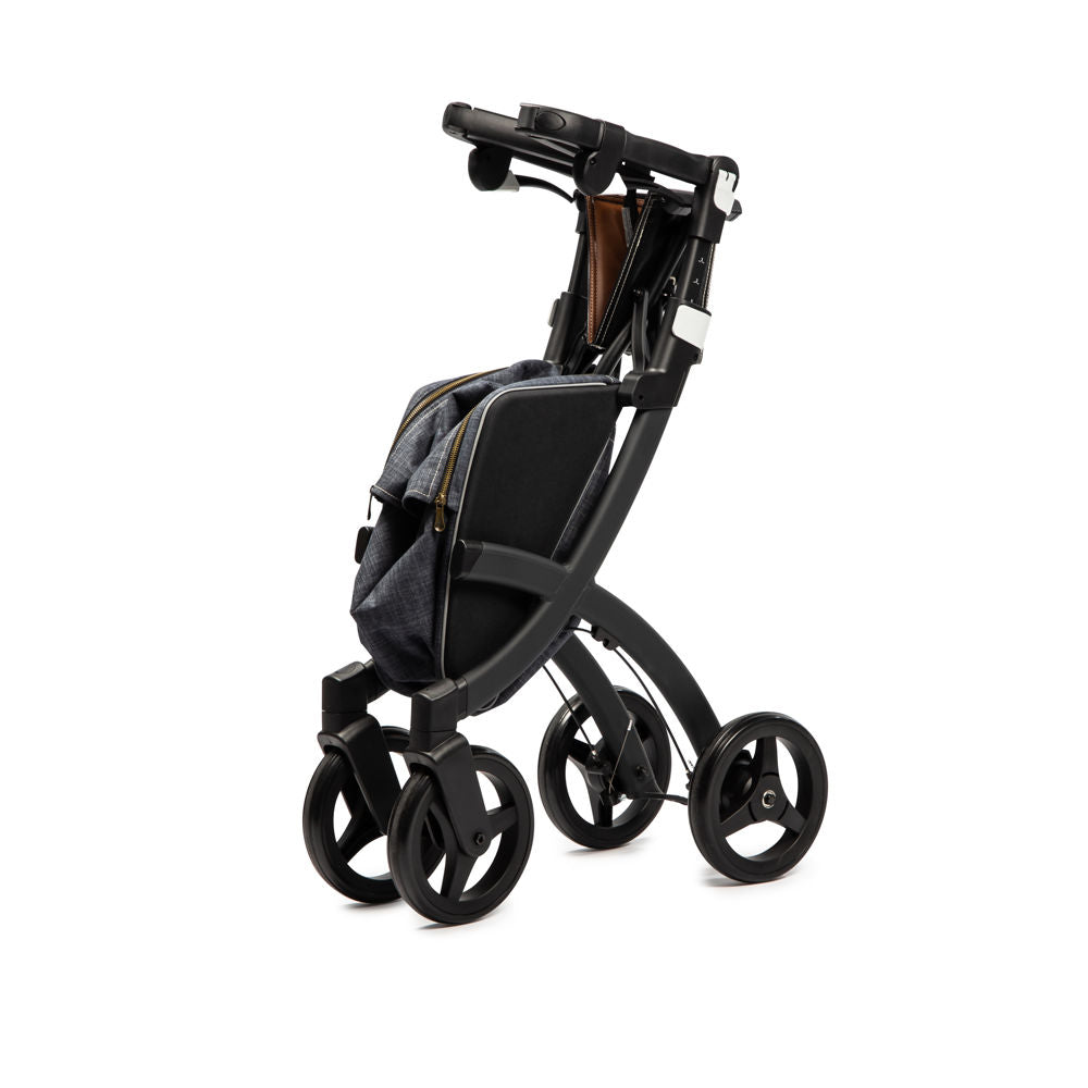 shows a black framed rollz flex rollator folded up