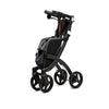 shows a black framed rollz flex rollator folded up