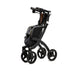shows a black framed rollz flex rollator folded up