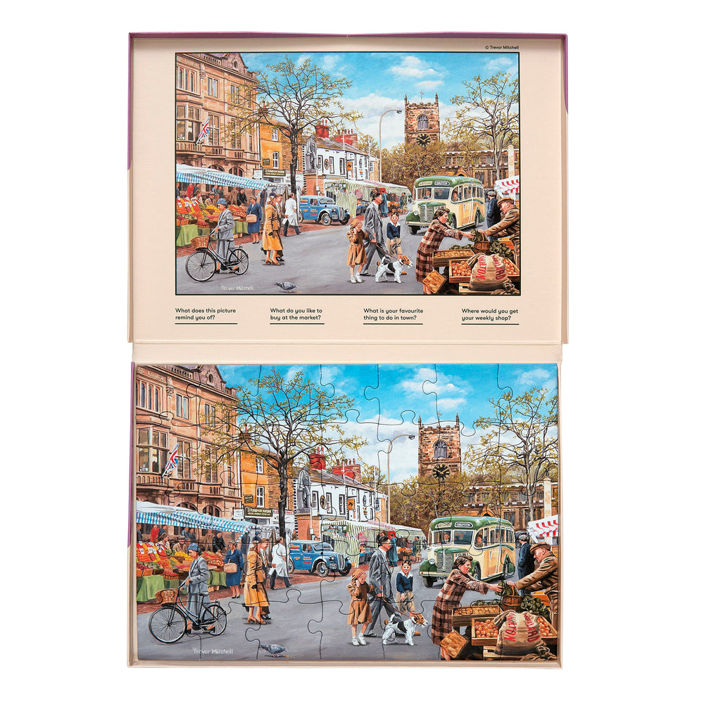 shows a completed autumn market jigsaw in the box