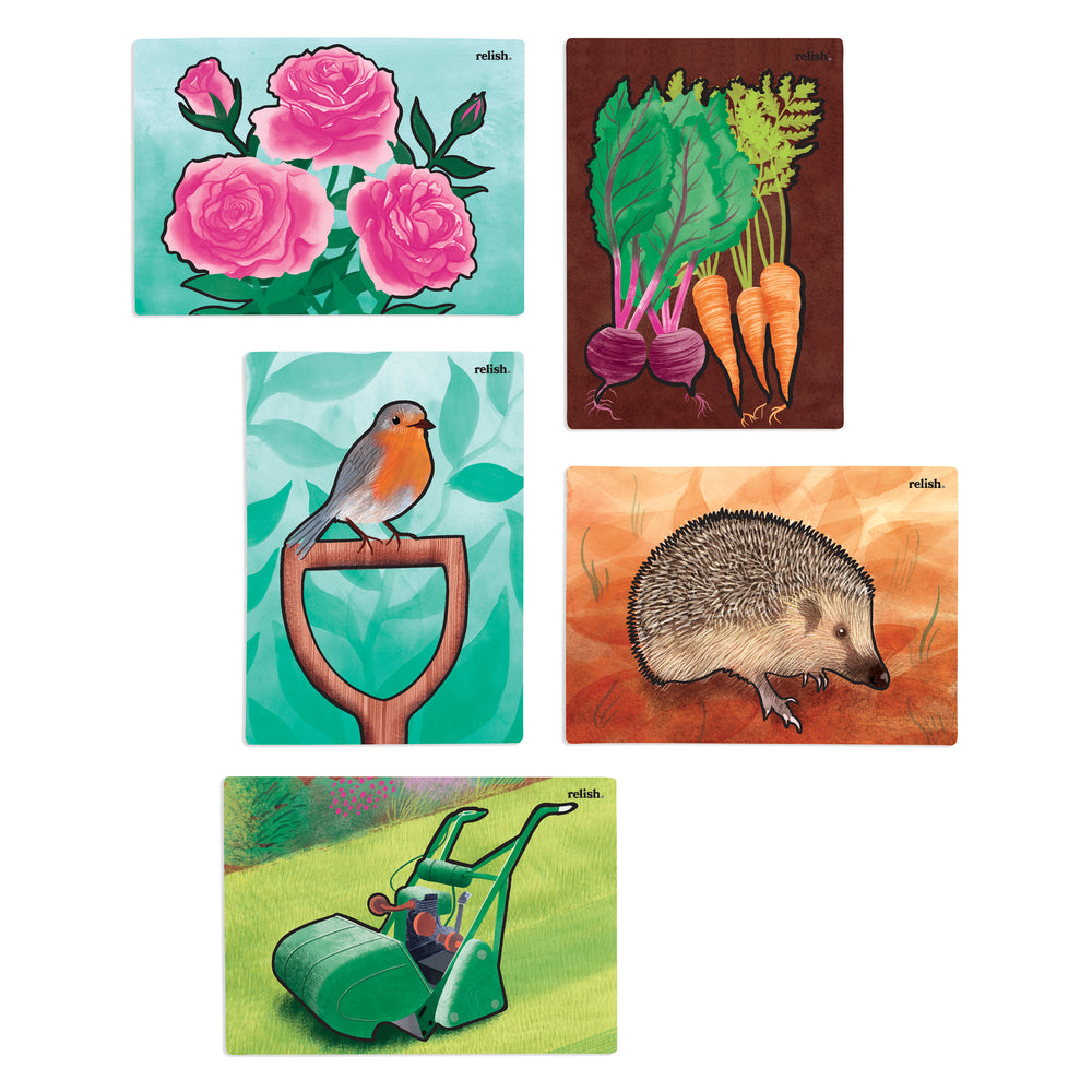 shows completed garden wonder paintings: roses, vegetables, a robin, a hedgehog and a lawnmower