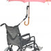 shows the adjustable wheelchair clamp being used to hold an umbrella above a wheelchair