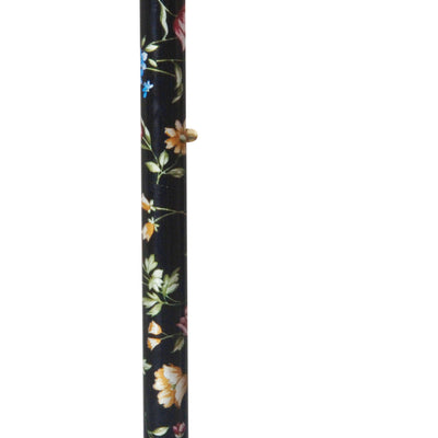 the image shows the full length of the classic canes tea party derby cane with black floral design