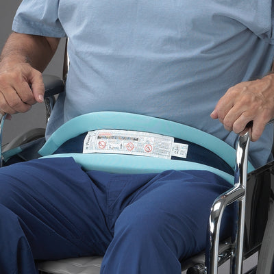 shows the Posey Padded Belt with Slide Buckle strapped across the lap of a man seated in a wheelchair