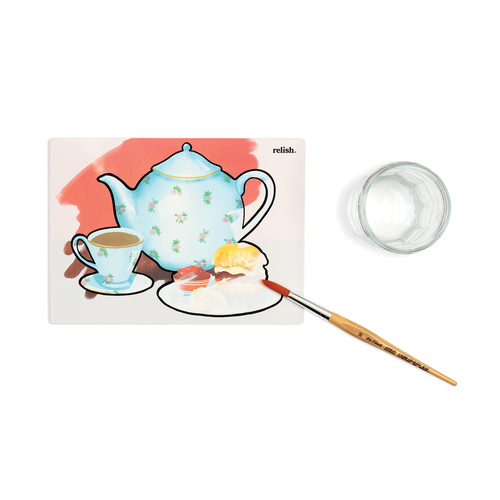 shows a nearly finished painting of a teapot, cup of tea and a scone.