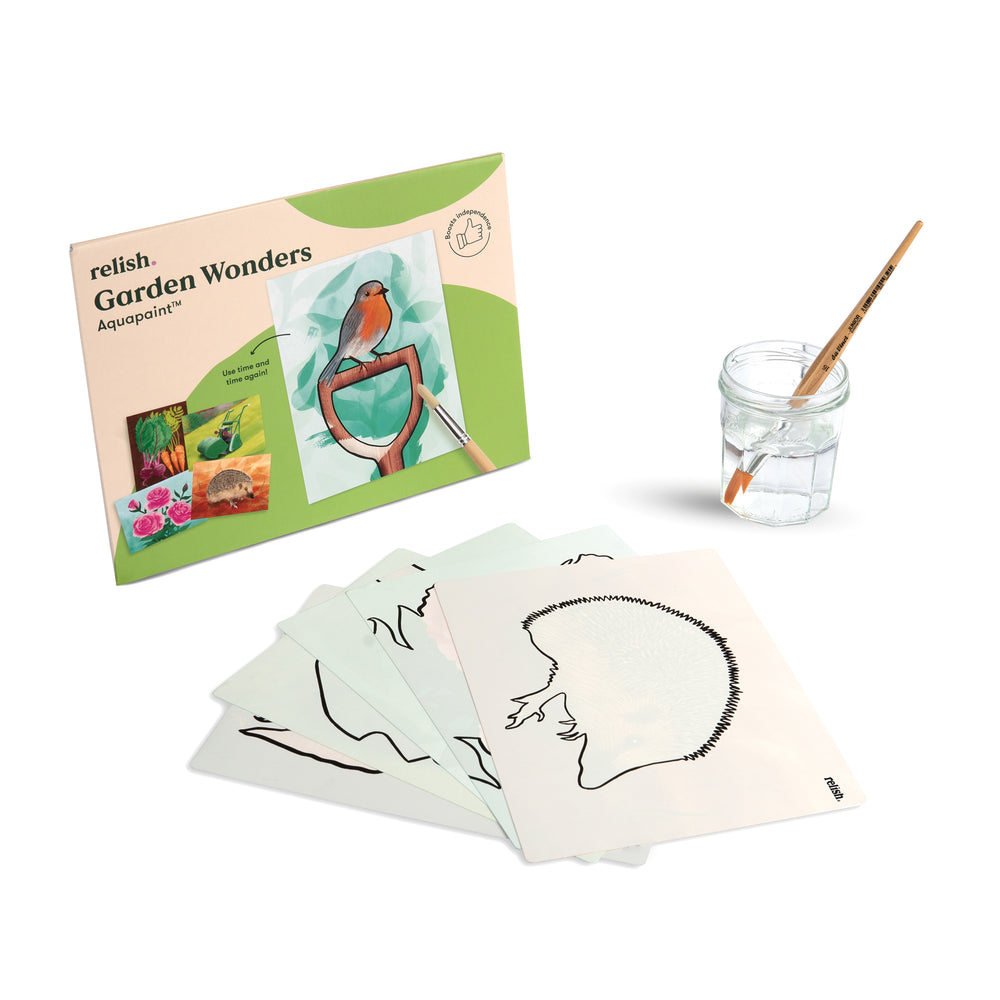 shows the garden wonders box, with a hedgehog template and a paint brush in a pot of water.