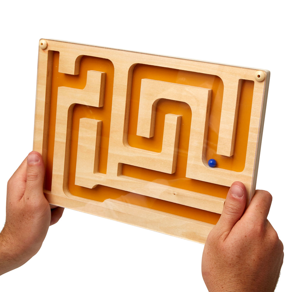 shows someone holding the track marble maze game