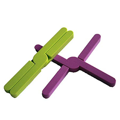 shows the StayPut silicone trivets in both lime green and purple