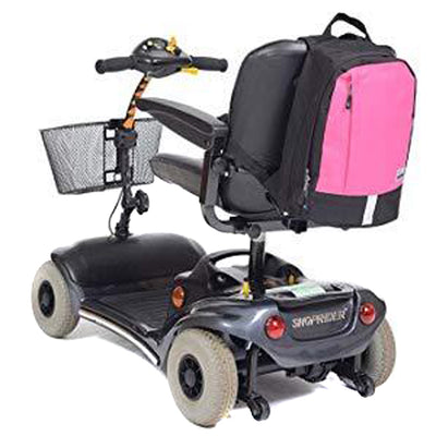 shows the Simplantex Mini Mobility Rucksack in Black/Hot Pink attached to the back of a mobility scooter