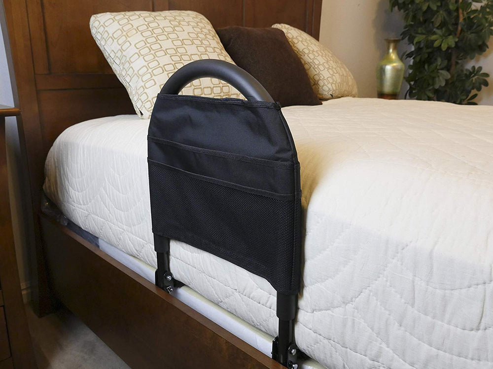 shows the bed rail advantage traveller attached to a bed