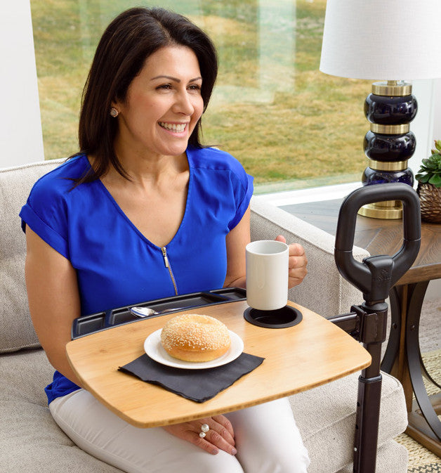 the Stander Assist-A-Tray being used