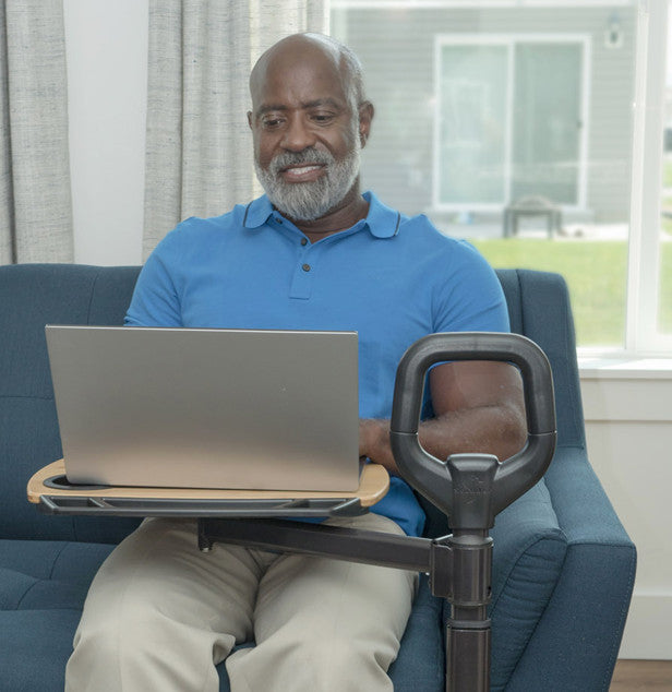 the Stander Assist-A-Tray being used