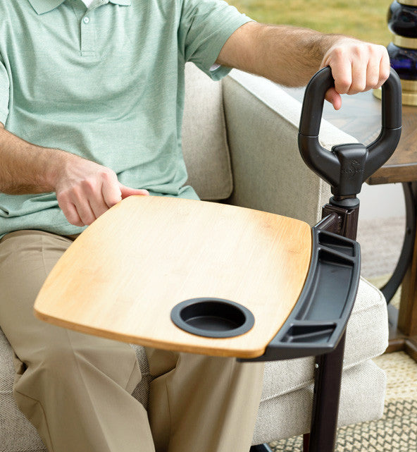 the Stander Assist-A-Tray being used