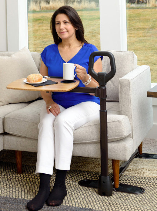 the Stander Assist-A-Tray being used
