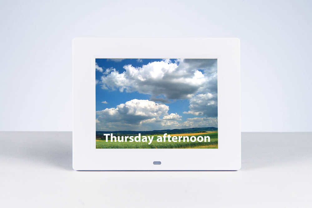 the reminder clock with 'thursday afternoon' displayed on it