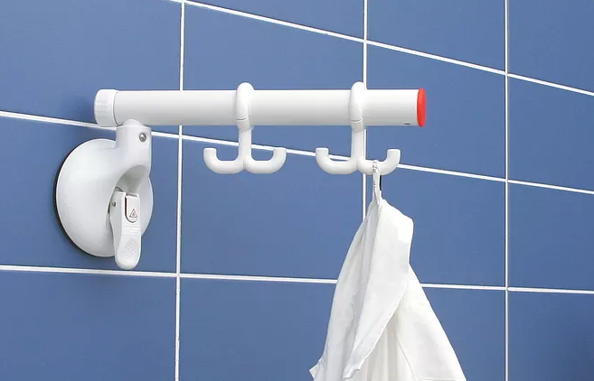 shows Mobeli grab rail with two dual hooks in place- a white shirt hangs from one of the hooks
