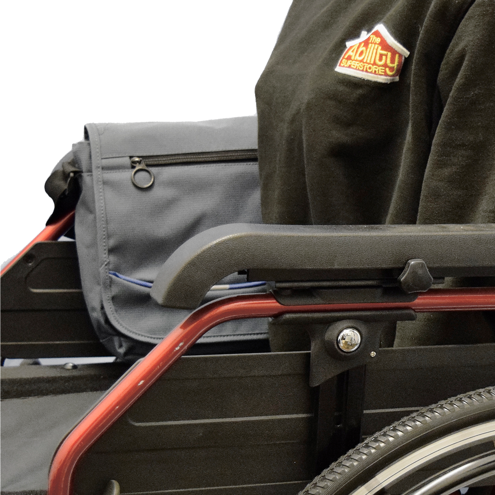 shows the Satchel Bag with Cross Body Strap fitted to the arm of a wheelchair