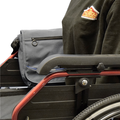 shows the Satchel Bag with Cross Body Strap fitted to the arm of a wheelchair