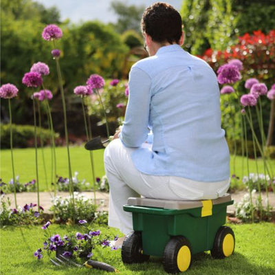 shows someone sitting on a garden roller stool toolbox and seat