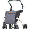 shows another white framed rollz flex rollator with a blue shopping bag