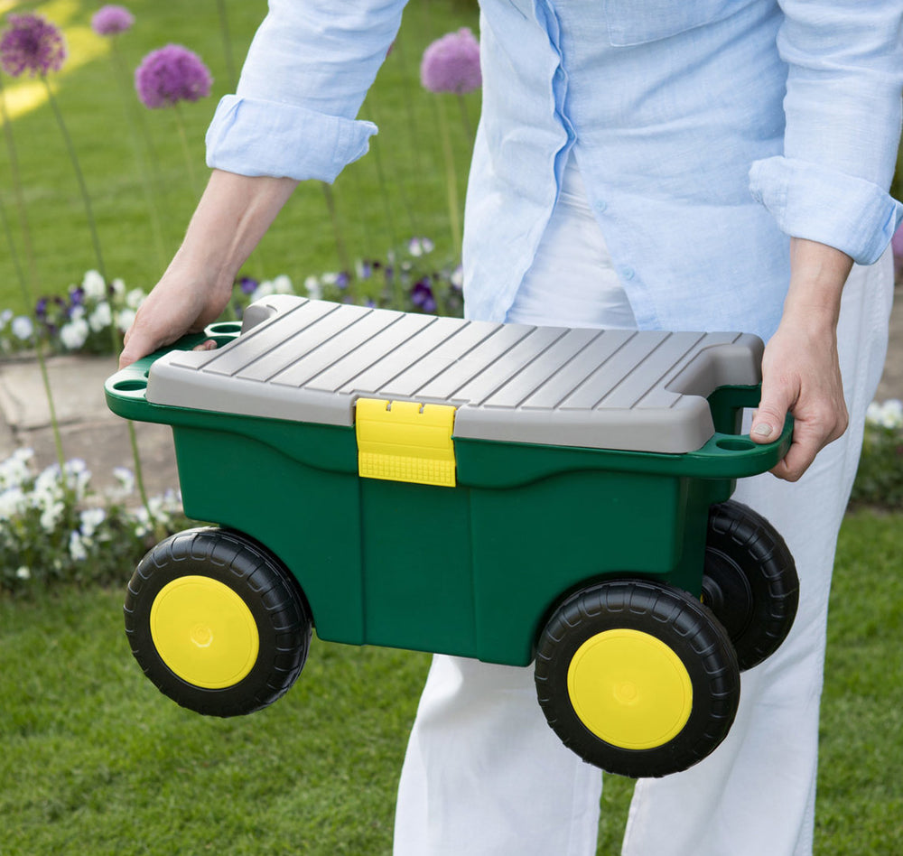 shows someone carrying the garden roller stool toolbox and seat