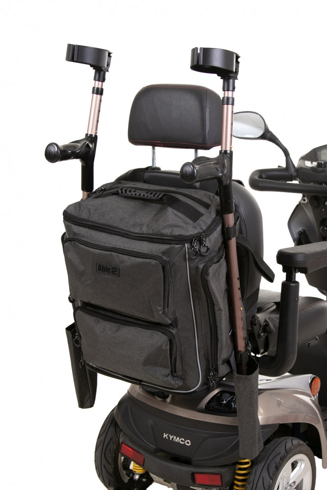 shows how the side pockets of the Torba Luxe bag can be used to transport crutches, canes or walking sticks